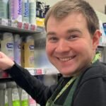Tom Boyd stacking goods at the supermarket