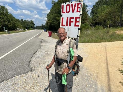 Steve Fugate with the love life sign